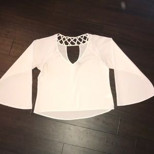 Semi sheer top with bell sleeves.